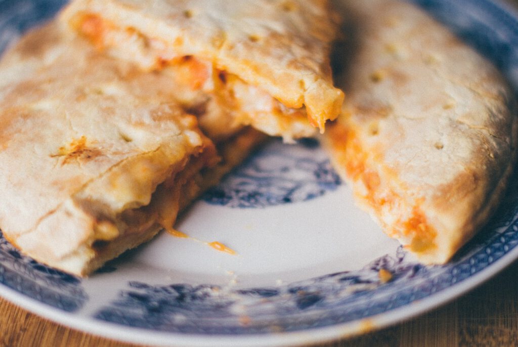 calzone, pizza, bread, cheese, food, dinner, lunch, plate, calzone, calzone, calzone, calzone, calzone